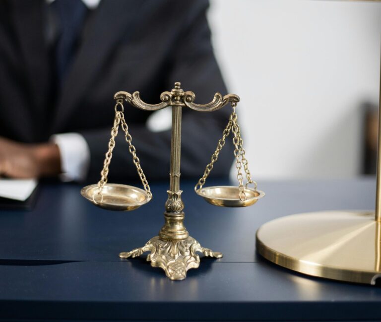 Equity Law vs Legal/At Law-A gavel and legal documents juxtaposed with a feather or the scales of justice